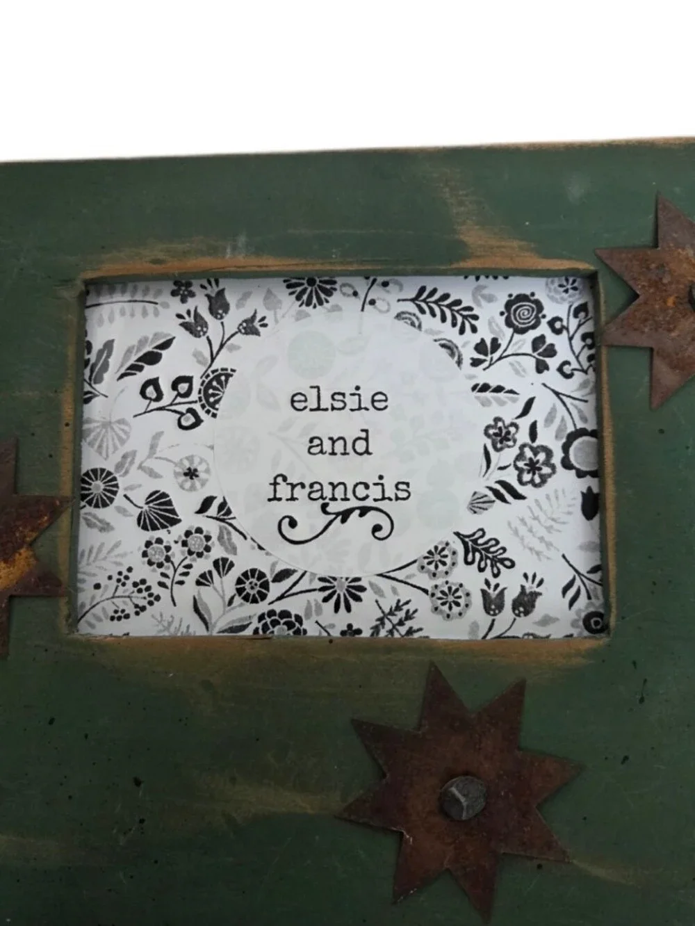 Distressed Vintage Green Wooden Frame with Rustic Metal Star Accent Landscape